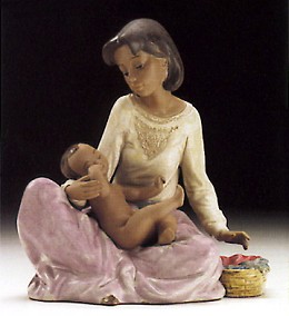 Dressing The Baby 1994-97 by Lladro Image is watermarked for copyright protection and is not present on the actual art work.