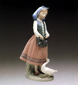Josepha Feeding Duck 1984-91 by Lladro Image is watermarked for copyright protection and is not present on the actual art work.