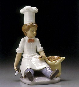 Apprentice Chef 1995-99 by Lladro Image is watermarked for copyright protection and is not present on the actual art work.