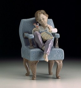 An Unexpected Gift (boy) by Lladro Image is watermarked for copyright protection and is not present on the actual art work.