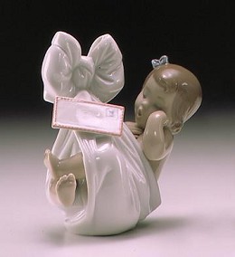 Heaven's Gift With Card (girl) by Lladro Image is watermarked for copyright protection and is not present on the actual art work.